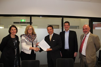  Mr. Alex Mejia receives the formal Letter of Intention from the University of Newcastle requesting UNITAR to establish a new CIFAL Center in Australia at the main campus of the University