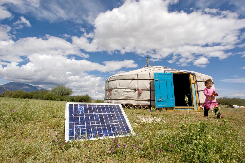 A family in Tarialan, Uvs Province, Mongolia, uses a solar panel to generate power for their ger, a traditional Mongolian tent. UN Photo/Eskinder Debebe