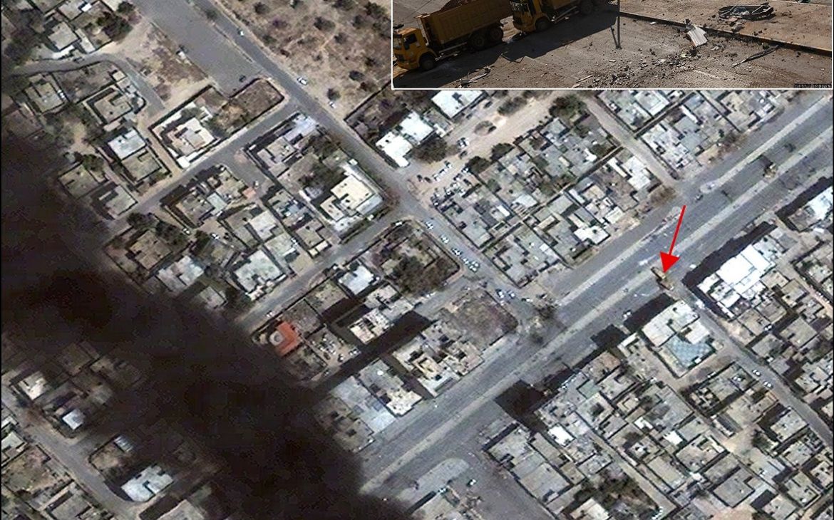 a photograph of dump trucks used as a blockade in Misratah is precisely located in a satellite image from 23 April 2011 (see red arrow).