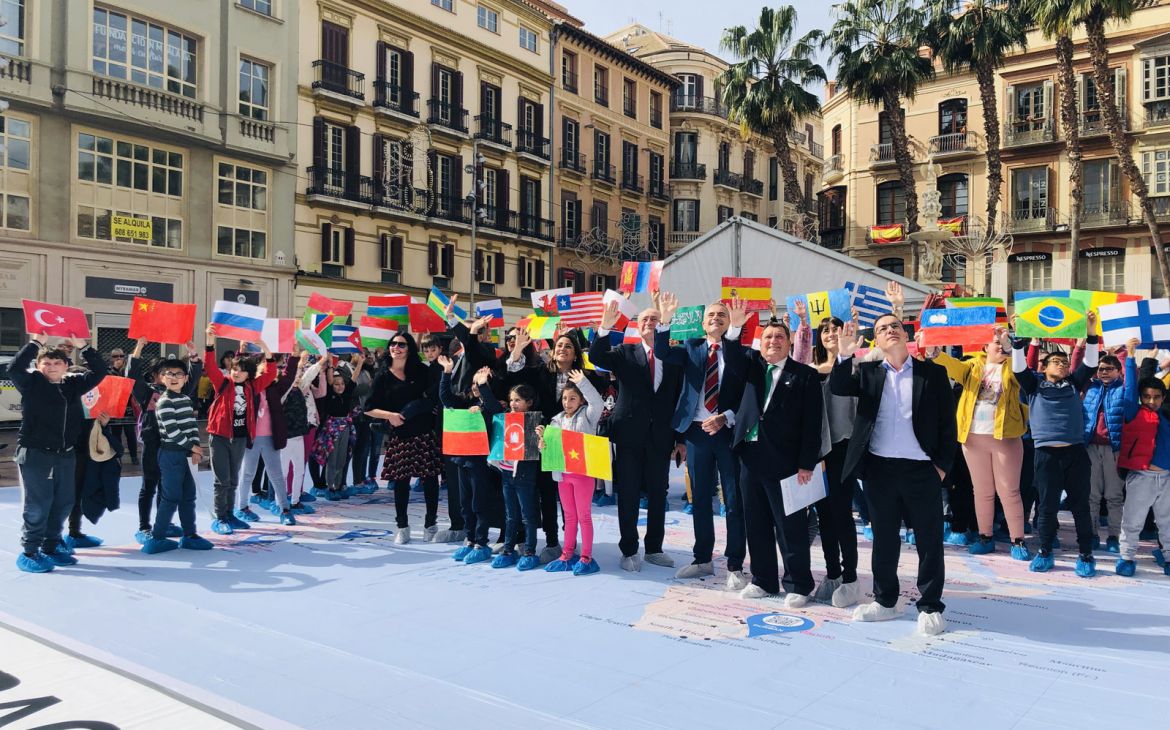 Photo 2: Children from different nationalities gathered at the historic centre of Malaga
