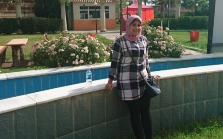 Salma Khalifa poses for the camera by the garden 