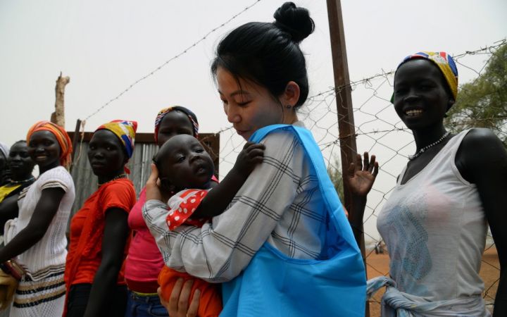 UNHCR’s Eujin Byun holds a refugee baby in her arms at a refugee camp in South Sudan UNHCR’s Eujin Byun holds a refugee baby in her arms at a refugee camp in South Sudan