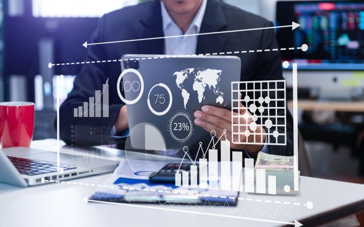 Discover Reporting on EdApp with the Educate All Impact Report Man using his tablet, business analytics