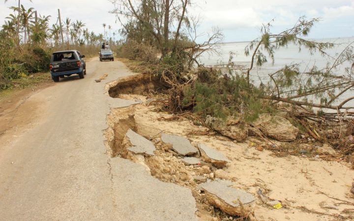 Roads and other public infrastructure on Lifuka Island, Tonga suffered significant damage from Cyclone Ian in January 2014. Photo by Scott McLennan / DFAT via Wikimedia CC BY 2.0