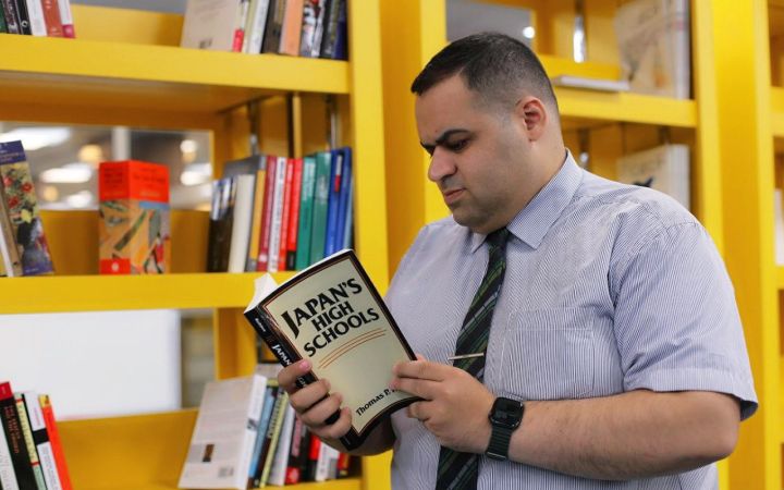 Sayf, Secretary General of the Libraries (Director of the Central Library) at the University of Mosul Sayf is reading a book at the Central Library