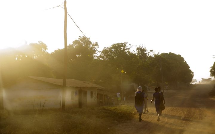In the town of Yoko, Cameroon children walk to school, a simple daily activity that has become more dangerous due to armed conflict in the Northwest and Southwest regions. Photo: UN Women/Ryan Brown CC BY-NC-ND 2.0  https://www.flickr.com/photos/unwomen/47639051451/in/album-72157677785090007/ In the town of Yoko, Cameroon children walk to school, a simple daily activity that has become more dangerous due to armed conflict in the Northwest and Southwest regions.
