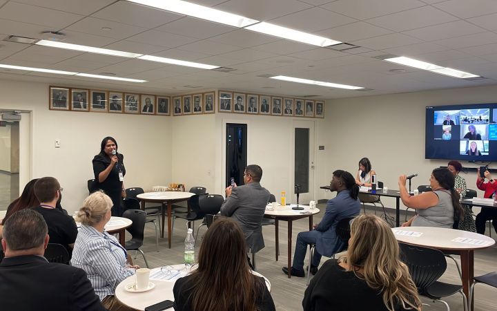GDI Fellow Introduces herself and Speaks about GDI Essay GDI Fellow Introduces herself in front of conference room