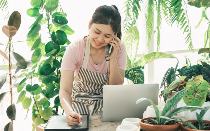 Women’s Entrepreneurship Woman on a call and on her tablet