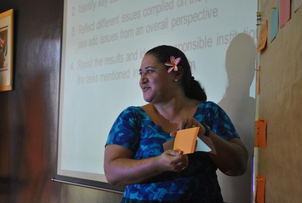 Photo 6: One of the trainees from Samoa performs a “trainers on stage” session summarizing the main findings of group matrix exercises on specific NAP country situations.
