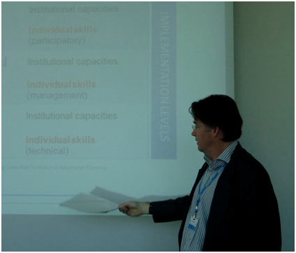 Photo 2: Angus Mackay from UNITAR illustrates some of the elements of the skills assessment framework